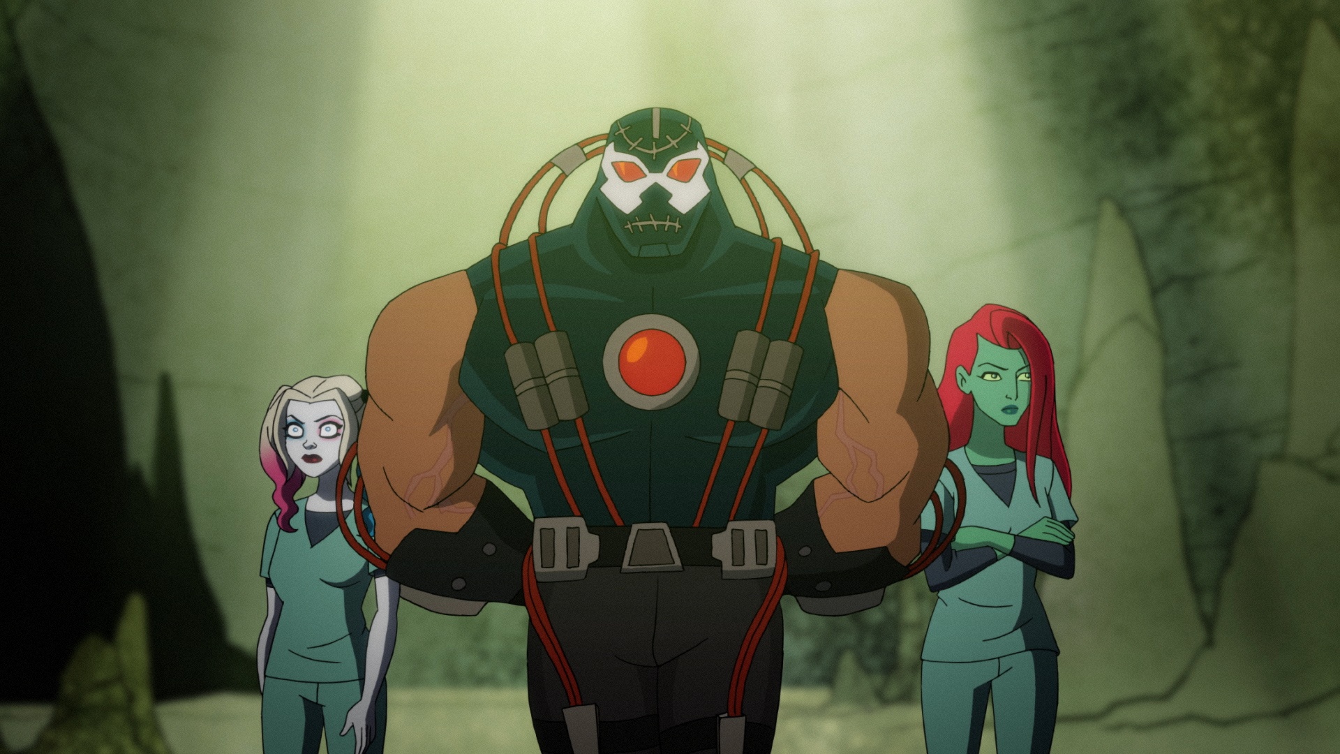 Bane attentively leads prisoners Harley and Ivy in "the Pit."