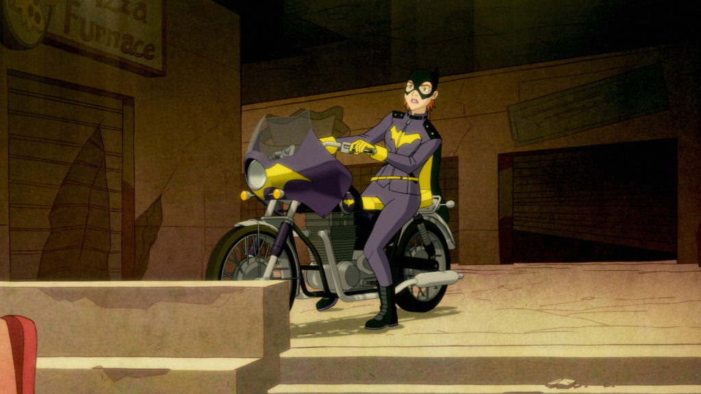 Batgirl rides into Harley's lair on her motorcycle.