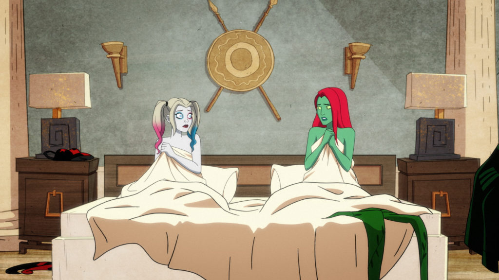 Harley Quinn and Poison Ivy in bed together after realizing they spent the night together, romantically.