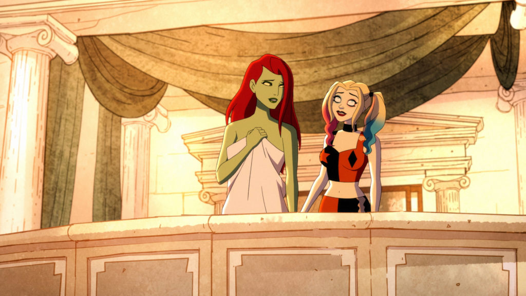 A fully clothed Harley Quinn and a covered up Poison Ivy talk bout their future on a balcony.