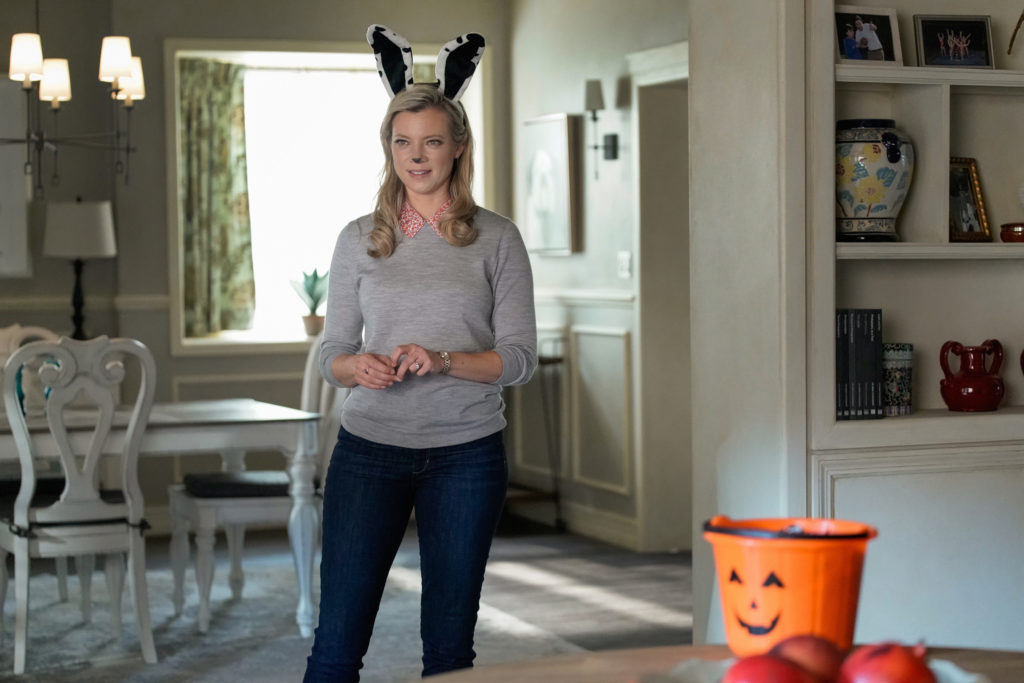 Amy Smart as Barbara Whitmore dressed in Halloween themed bunny ears. 