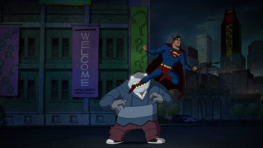 Mind-controlled King Shark bites the leg of Superman.