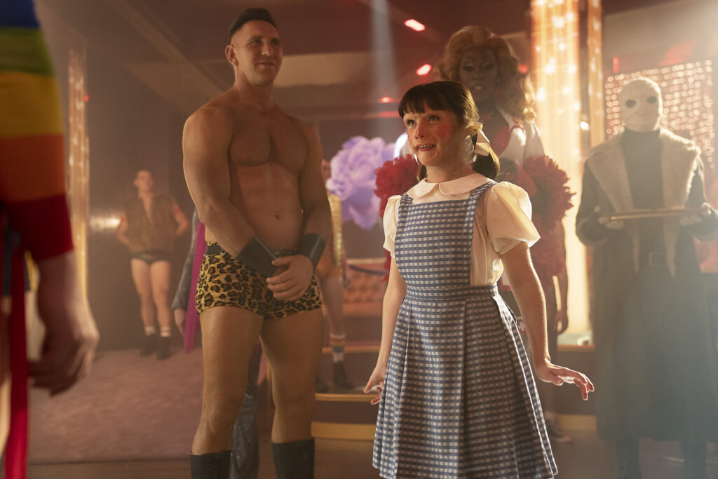 Left to Right: Devan Chandler Long as Flex Mentallo, Abigail Shapiro as Dorothy Spinner, Alan Mingo Jr. as Maura Lee Karupt, and Matthew Zuk (on-set performer) and Matt Bomer (voice) as Larry Trainor