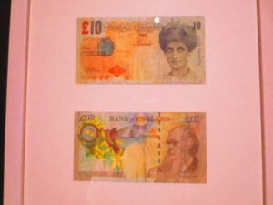 Di-Faced Tenners by Banksy. Banksy printed 10 pound banknotes, replacing the face of Queen Elizabeth with Diana Spencer. Above at the centre of the note, are the words “Banksy of England” in place of “Bank of England”.