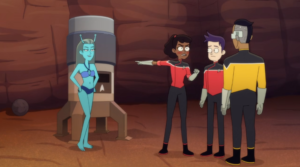 Mariner blushing and pointing to a sexy blue alien woman while Boimler and Rutherford look on
