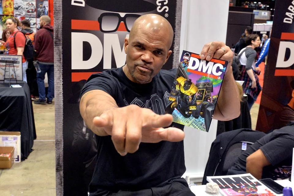 Daryl from Run DMC showcasing his latest comic at a convention