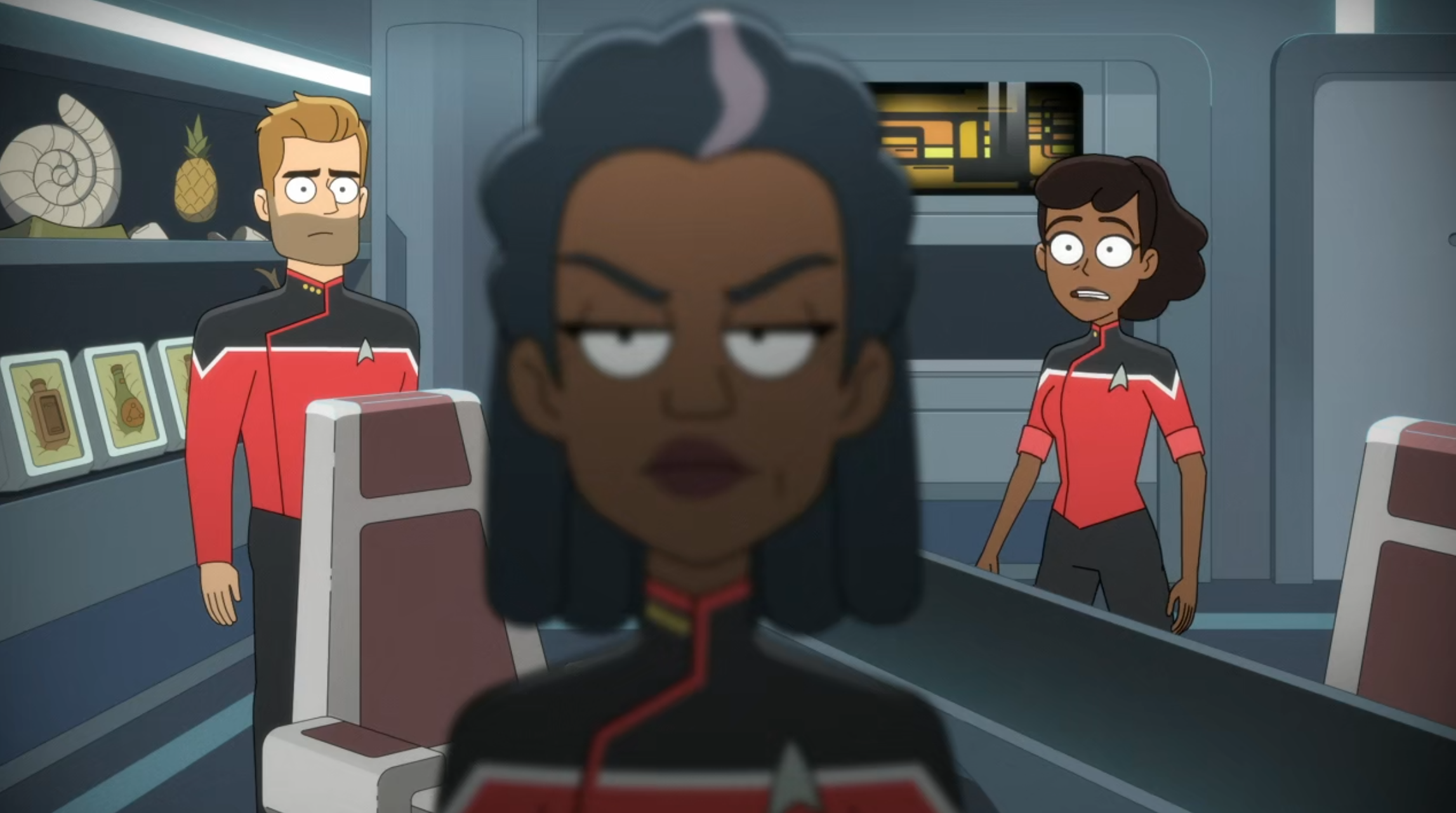 Mariner and Ransom look shocked as Freeman stares out the window of her office