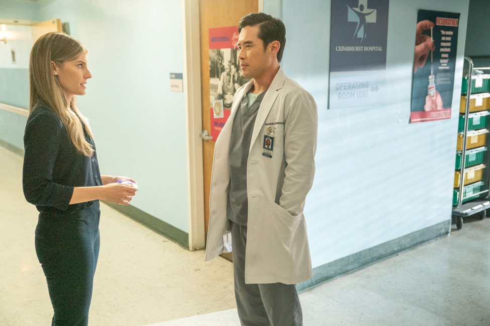 Addison talks to Ben in a hospital hallway