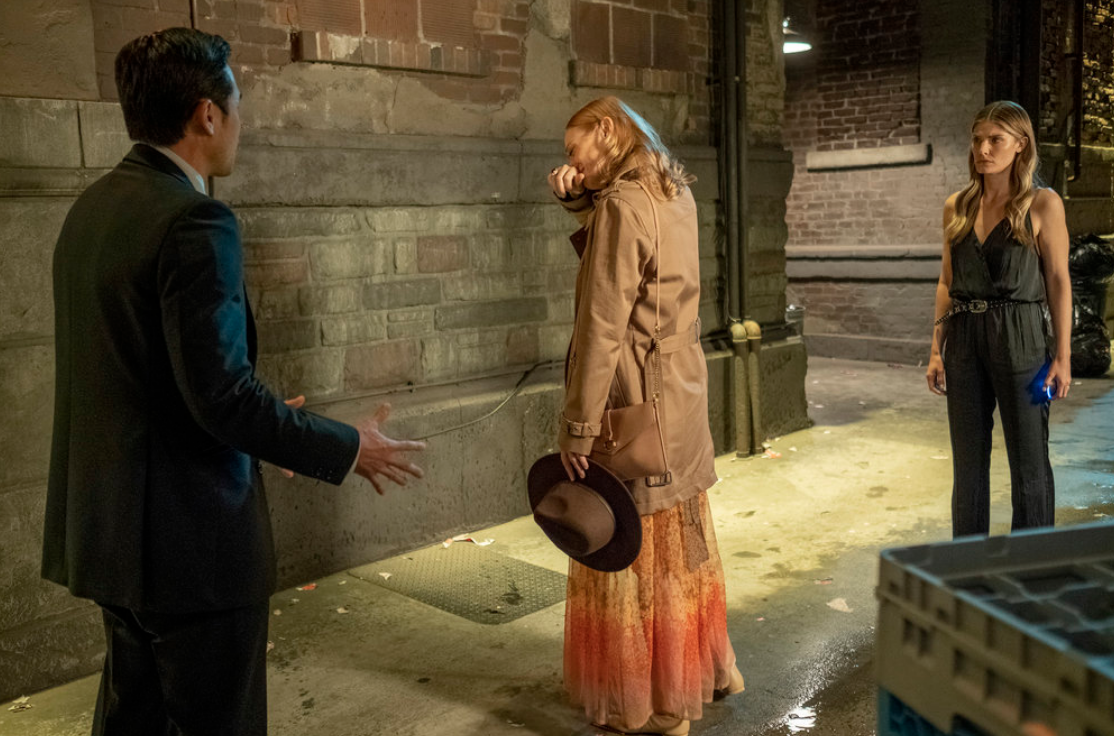 Ben, Carly, and Addison stand in an alley, with Carly looking upset