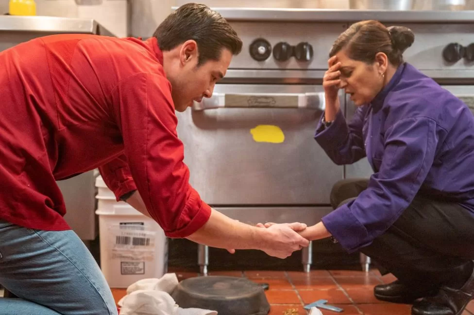 Ben and Sonali in the kitchen after an accident