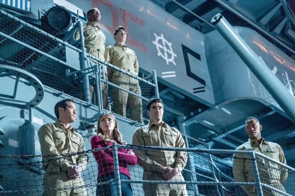 Ben, Addison, Augustine, and Walker on the balcony of a navy vessel