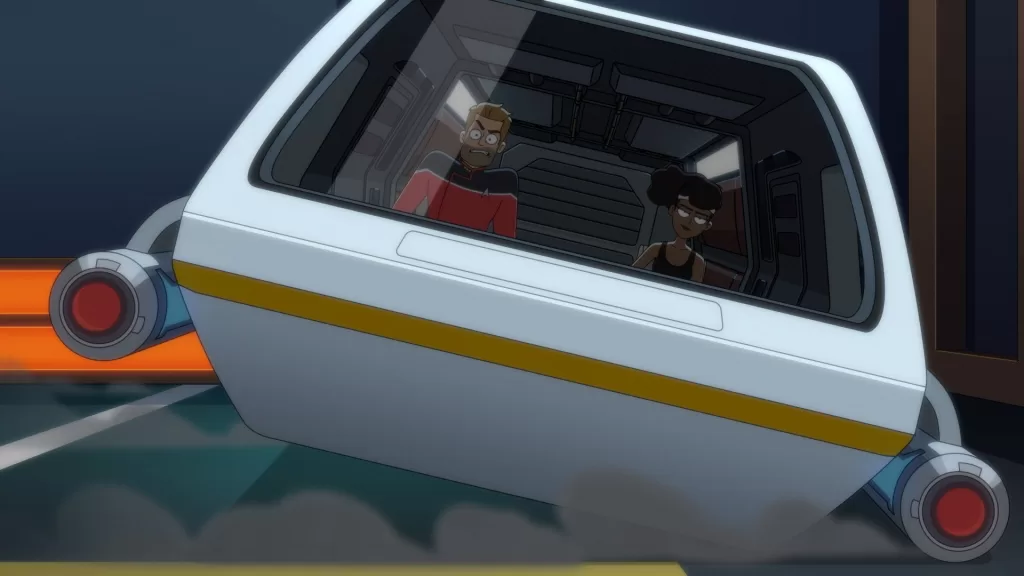 Ransom and Mariner in a shuttle, with Mariner piloting and Ransom looking angry